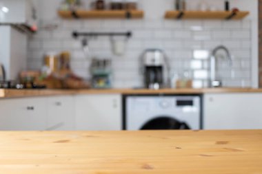 empty wooden tabletop and blurred kitchen mock up for product display