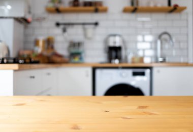 empty wooden tabletop and blurred kitchen mock up for product display