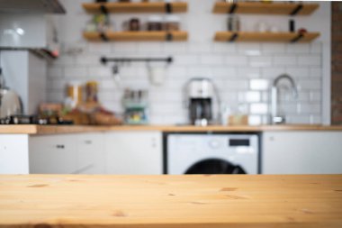 empty wooden tabletop and blurred kitchen mock up for product display