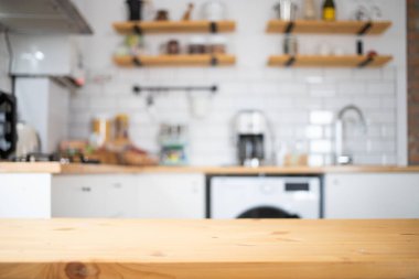empty wooden tabletop and blurred kitchen mock up for product display