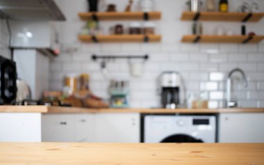 empty wooden tabletop and blurred kitchen mock up for product display