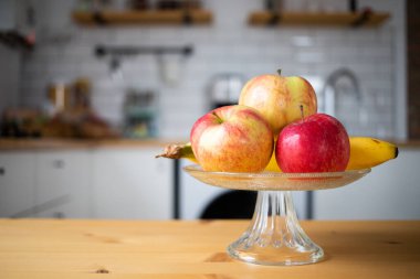 fresh fruit apples and bananas in modern kitchen
