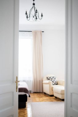 vintage white door opening into bedroom