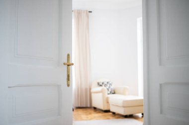 vintage white door opening into bedroom