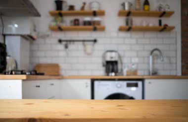 empty wooden tabletop and blurred kitchen mock up for product display