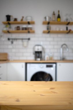 empty wooden tabletop and blurred kitchen mock up for product display