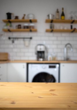 empty wooden tabletop and blurred kitchen mock up for product display