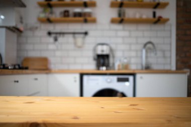 empty wooden tabletop and blurred kitchen mock up for product display