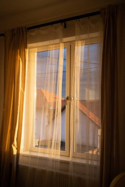 white curtain of living room at sunset 