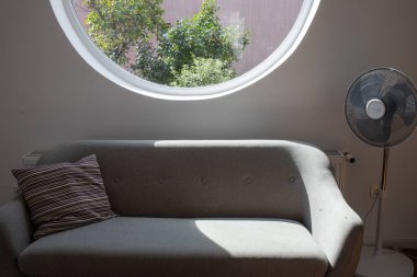 grey sofa detail in bright living room