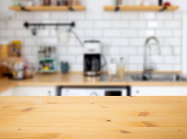 empty wooden tabletop and blurred kitchen mock up for product display