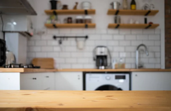 empty wooden tabletop and blurred kitchen mock up for product display