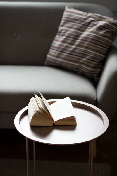 open book on a living room table