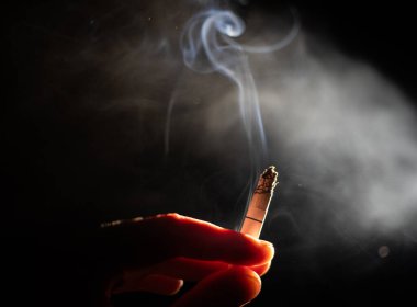 cigarette burning in the dark quit smoking