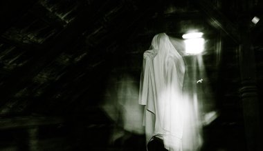 blurred image of ghost in the attic haunted house for Halloween