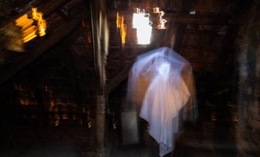 blurred image of ghost in the attic haunted house for Halloween
