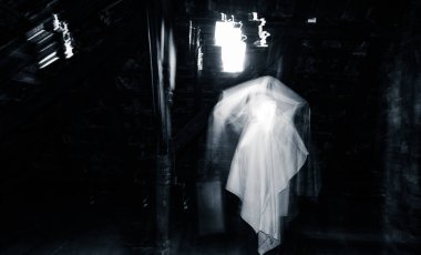 blurred image of ghost in the attic haunted house for Halloween