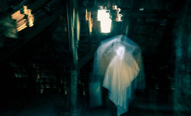 blurred image of ghost in the attic haunted house for Halloween