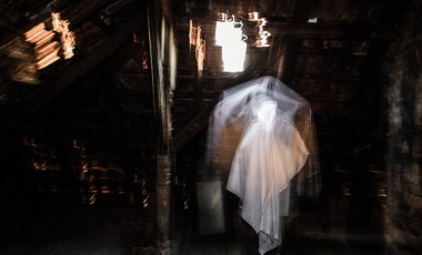 blurred image of ghost in the attic haunted house for Halloween