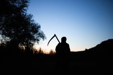 grim reaper, the death itself, scary horror shot of Grim Reaper holding scythe