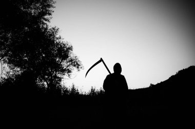 grim reaper, the death itself, scary horror shot of Grim Reaper holding scythe