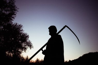 grim reaper, the death itself, scary horror shot of Grim Reaper holding scythe