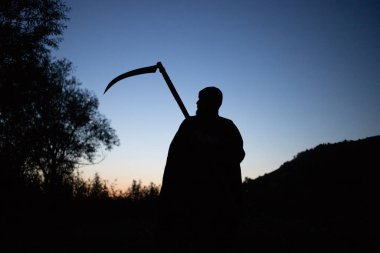 grim reaper, the death itself, scary horror shot of Grim Reaper holding scythe