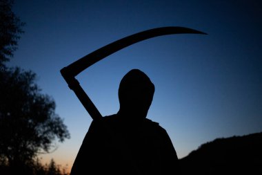 grim reaper, the death itself, scary horror shot of Grim Reaper holding scythe
