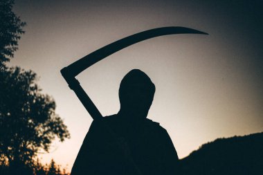 grim reaper, the death itself, scary horror shot of Grim Reaper holding scythe