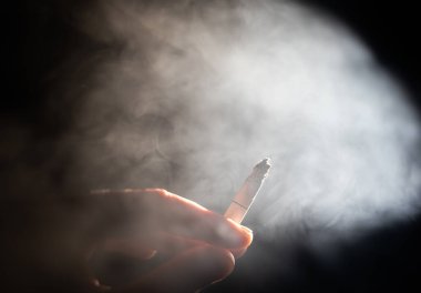 cigarette burning in the dark quit smoking