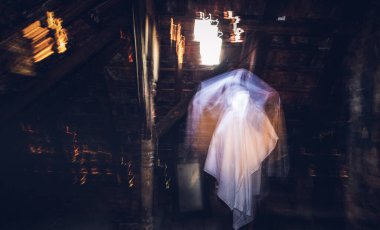 blurred image of ghost in the attic haunted house for Halloween