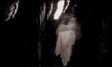 blurred image of ghost in the attic haunted house for Halloween