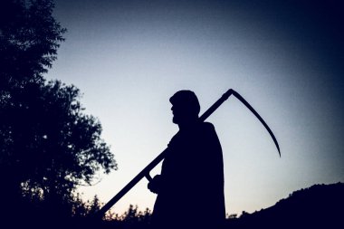 grim reaper, the death itself, scary horror shot of Grim Reaper holding scythe