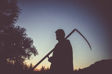 grim reaper, the death itself, scary horror shot of Grim Reaper holding scythe