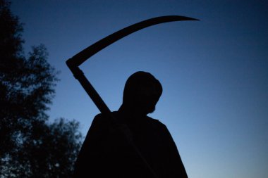 grim reaper, the death itself, scary horror shot of Grim Reaper holding scythe