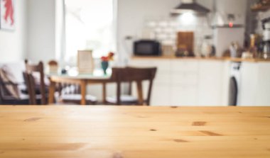 empty wooden tabletop and blurred kitchen mock up for product display