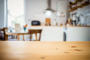 empty wooden tabletop and blurred kitchen mock up for product display