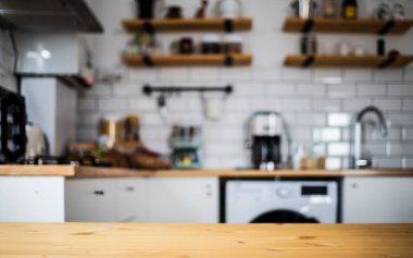 empty wooden tabletop and blurred kitchen mock up for product display