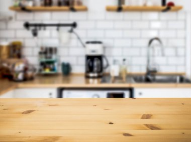 empty wooden tabletop and blurred kitchen mock up for product display