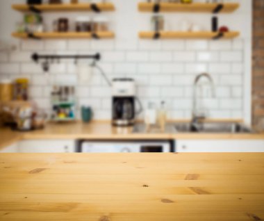 empty wooden tabletop and blurred kitchen mock up for product display
