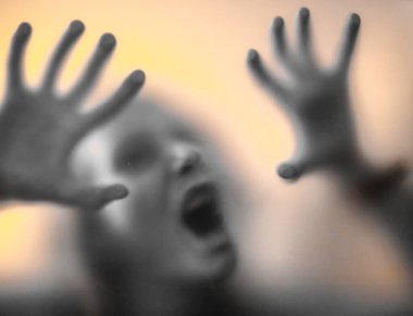 scary picture of hands behind glass, horror ghost woman behind door, Halloween  concept