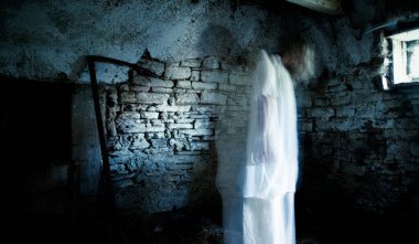 scary ghost in abandoned building at night Halloween background