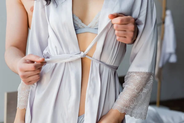 Cropped View Shirtless Man Untying Silk Robe Sensual Woman — Stock Photo, Image