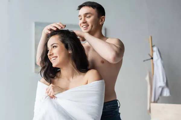 Happy Shirtless Man Touching Hair Smiling Woman Wrapped Blanket — Stock Photo, Image