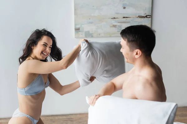 Cheerful Sexy Couple Having Pillow Fight Bedroom — Stock Photo, Image