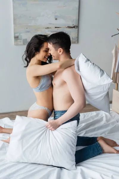 Side View Happy Sexy Couple Hugging While Holding Pillows Bedroom — Stock Photo, Image