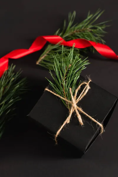 Top View Gift Box Fir Branch Blurred Red Ribbon Black — Stock Photo, Image