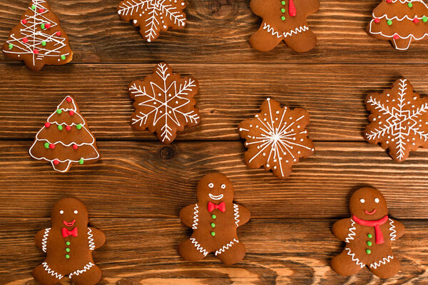 top view of gingerbread cookies on wooden surface 