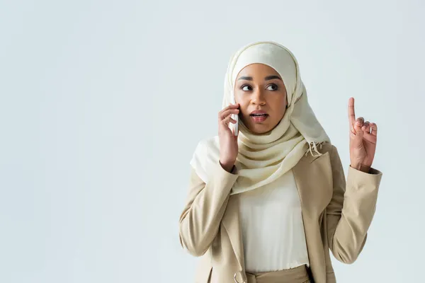 Young Muslim Woman Hijab Talking Smartphone While Pointing Isolated Grey — Stock Photo, Image