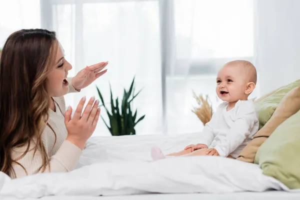 Positive Size Mom Playing Baby Girl Bed — Stock Photo, Image